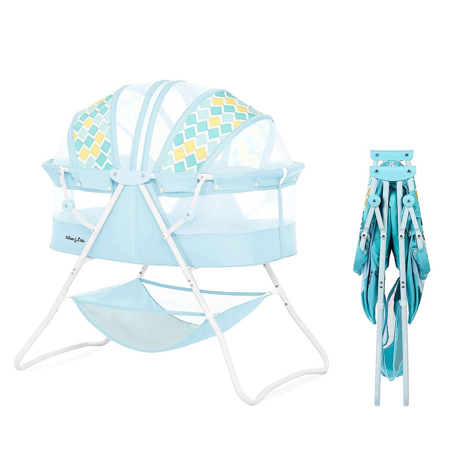 Karley Bassinet in Aqua, Lightweight Portable Baby Bassinet, Quick Fold and Easy to Carry, Adjustable Double Canopy, Indoor and Outdoor Bassinet with Large Storage Basket.